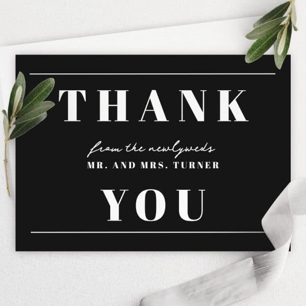 Black Thank You Card With White Text Reading Thank You From The Newlyweds Mr. And Mrs. Turner.