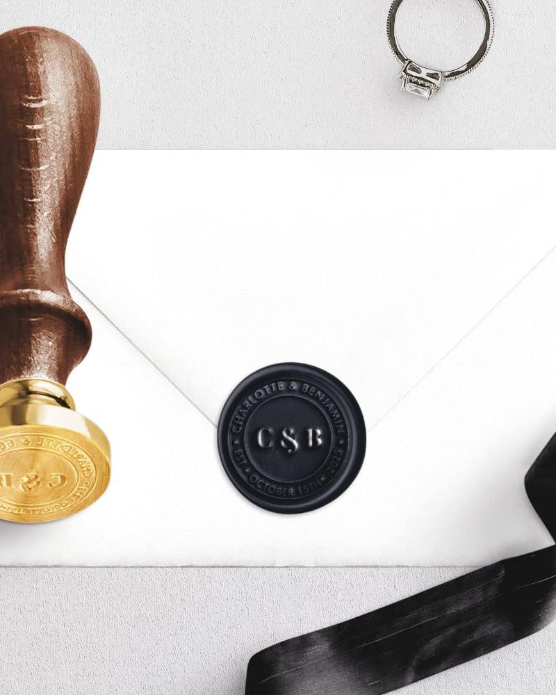 A black wax seal with initials CS&B on a white envelope.