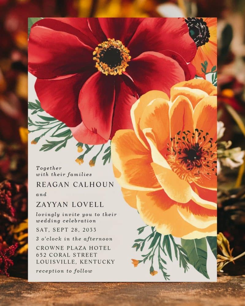 Wedding invitation with red and orange floral design.