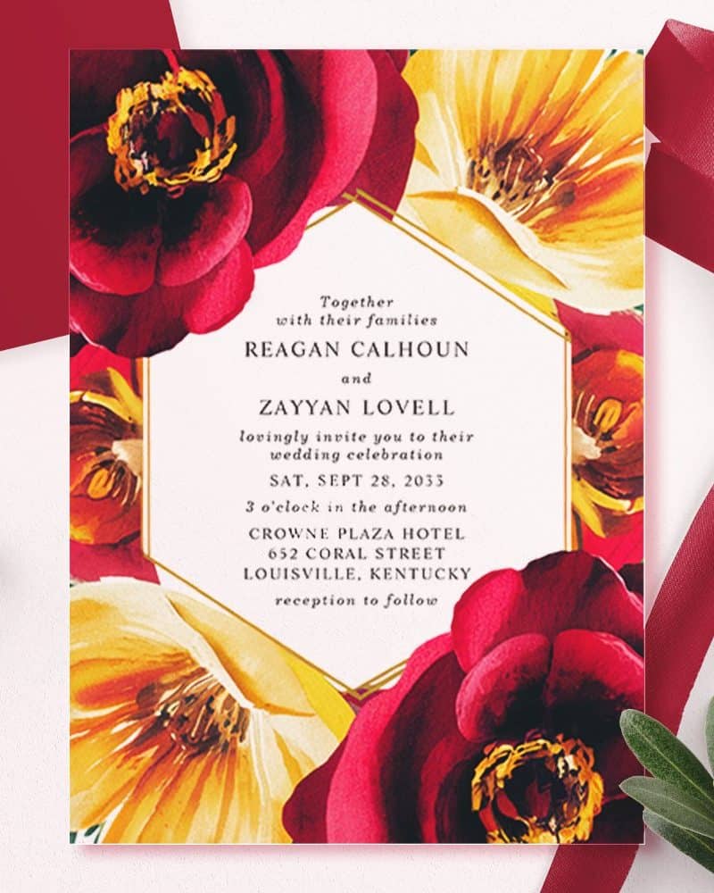 Wedding invitation with red and yellow floral design.