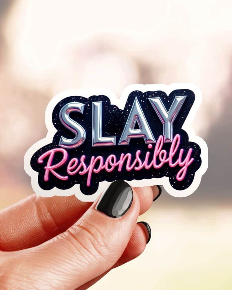 Hand holding a sticker that says Slay Responsibly.