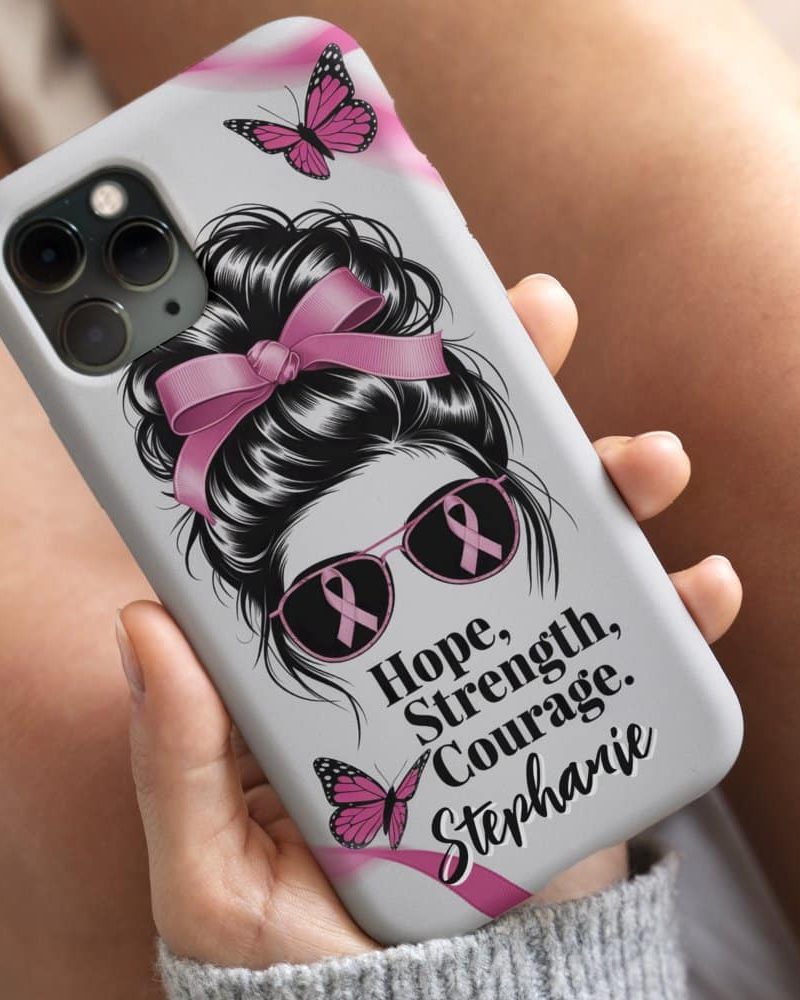 Phone case featuring a woman's messy bun hairstyle with a pink ribbon, pink sunglasses with pink ribbons, and butterflies. The words Hope, Strength, Courage, and Stephanie are included.