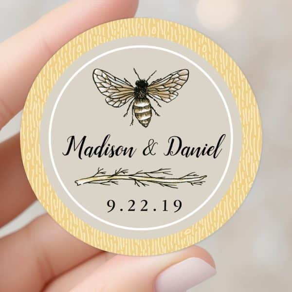 Round Wedding Sticker With A Bee Illustration, Madison &Amp; Daniel'S Names, And Their Wedding Date.