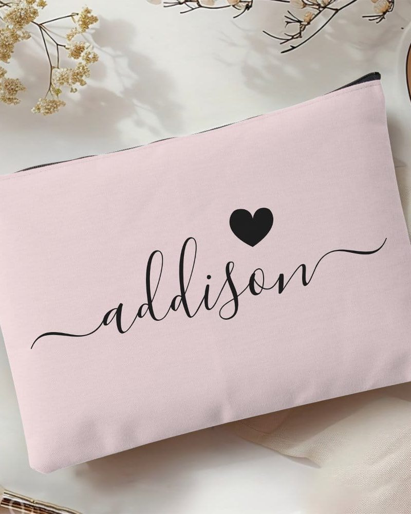 Pink makeup bag with the name Addison and a heart printed on it.