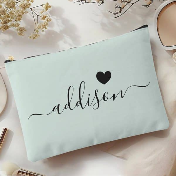Light Teal Zippered Pouch With The Name Addison In Elegant Script And A Small Black Heart.