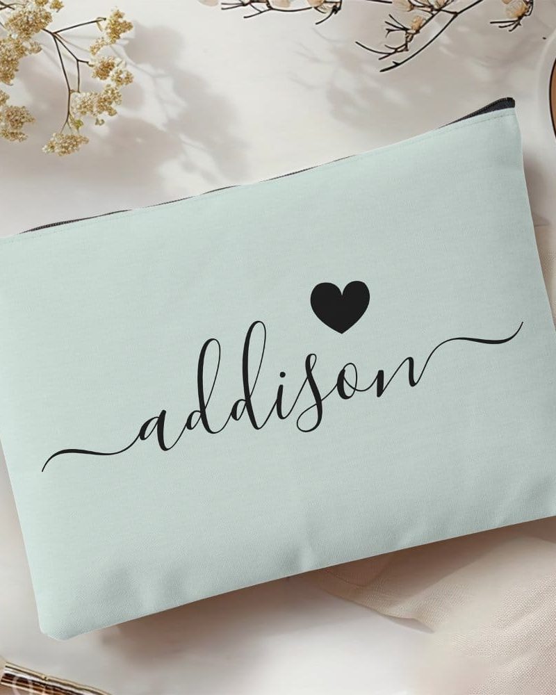 Light teal zippered pouch with the name Addison in elegant script and a small black heart.