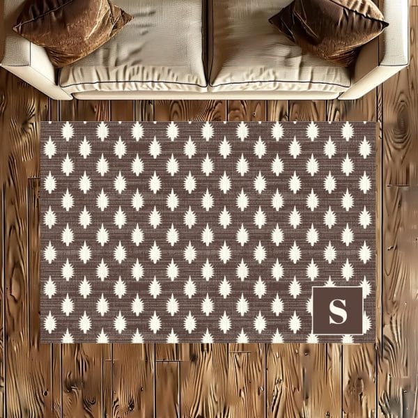Brown Area Rug With A Repeating Pattern Of Off-White Stylized Pine Trees And A Letter S In The Bottom Right Corner.