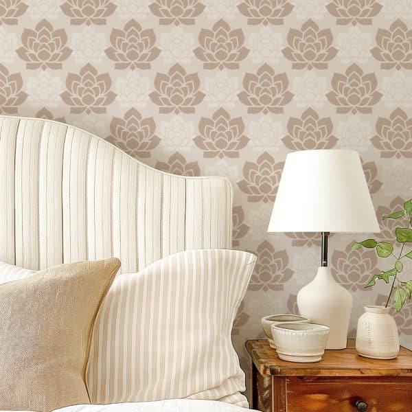 Beige Bedroom With A Curved Headboard And Striped Pillows Against A Wall Covered In A Repeating Lotus Flower Pattern Wallpaper.