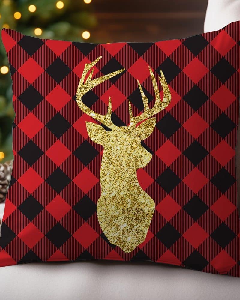 Red and black buffalo plaid throw pillow with a gold glitter deer.