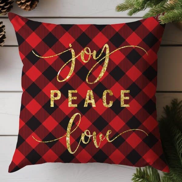 Red And Black Buffalo Plaid Throw Pillow With Gold Glitter Lettering Spelling Out Joy, Peace, Love.