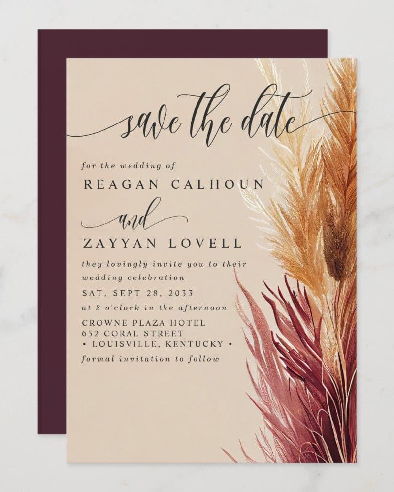 Save the date for the wedding of Reagan Calhoun and Zayyan Lovell, September 28, 2033, at the Crowne Plaza Hotel in Louisville, Kentucky. The design features pampas grass.