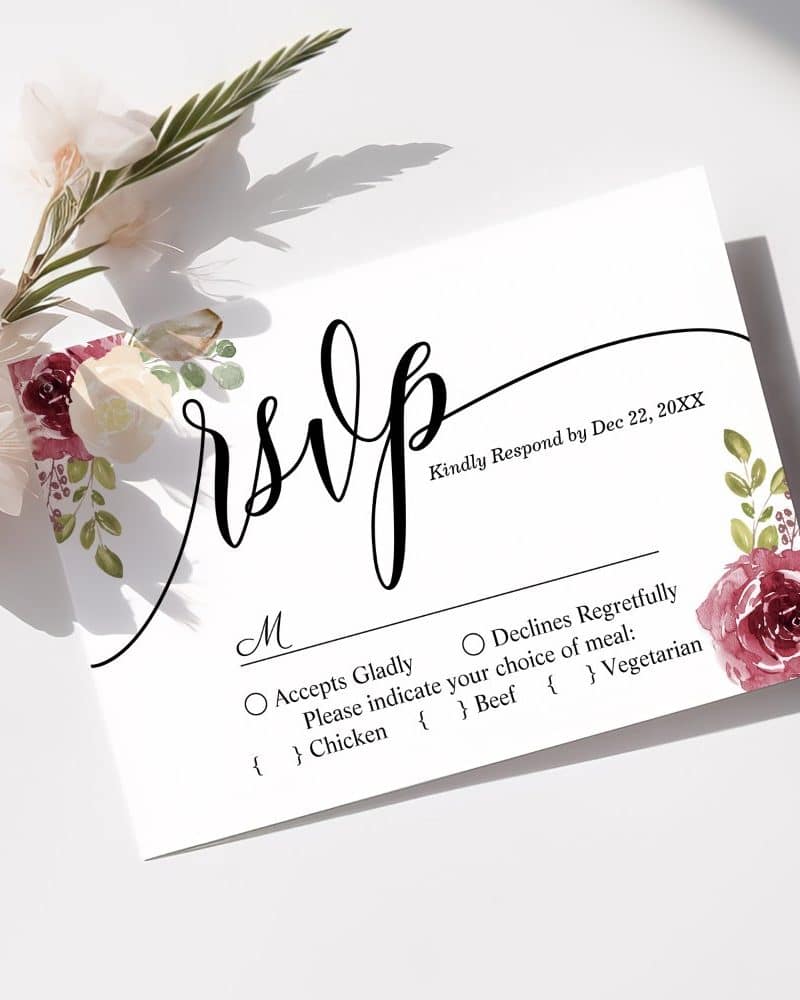 Wedding RSVP card with floral decorations, requesting response by December 22nd and meal choice.