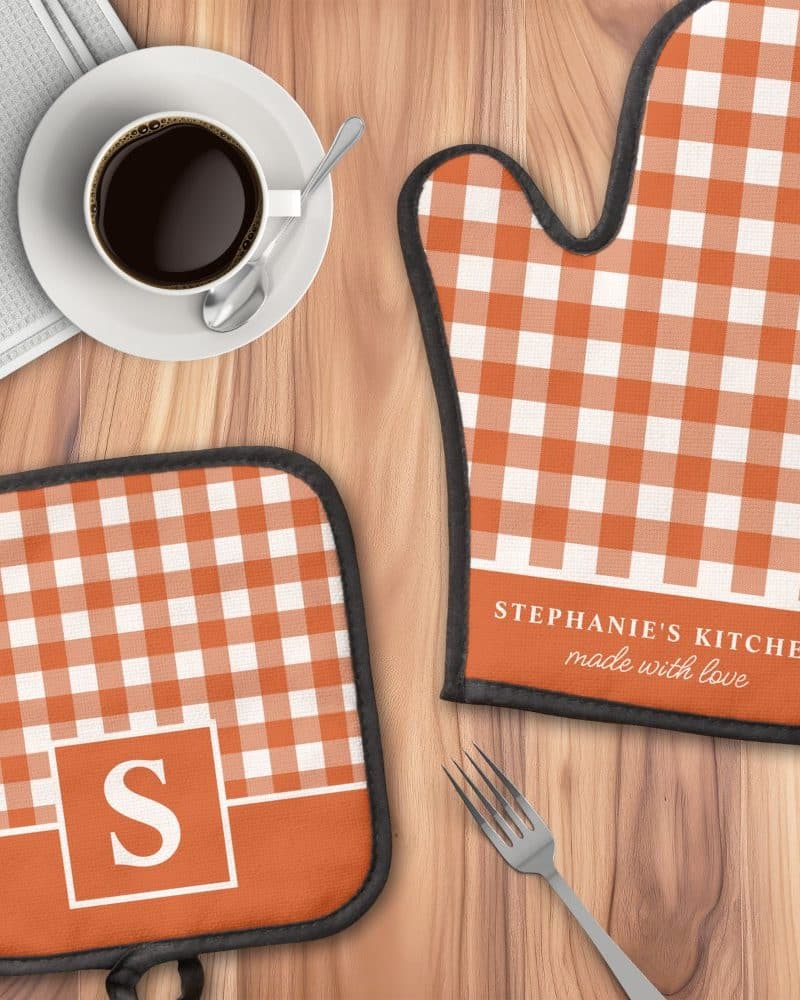 Orange and white gingham oven mitt and pot holder with personalized text.