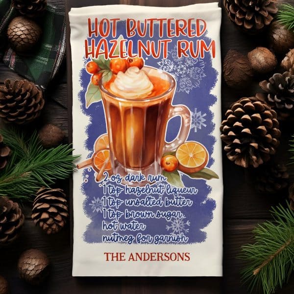 Tea Towel With Illustration Of A Mug Of Hot Buttered Hazelnut Rum And Recipe.