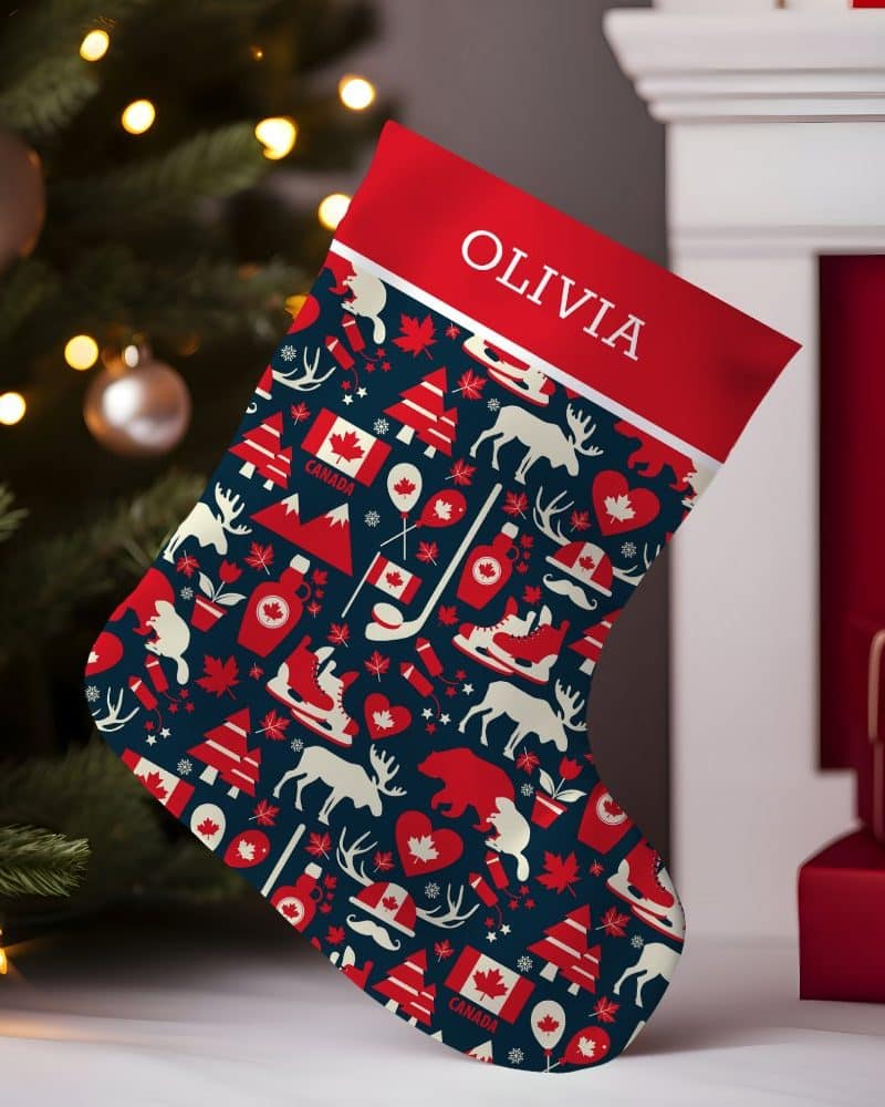 Personalized Christmas stocking with a Canadian theme, featuring red and white Canadian icons on a dark blue background. The name Olivia is at the top.