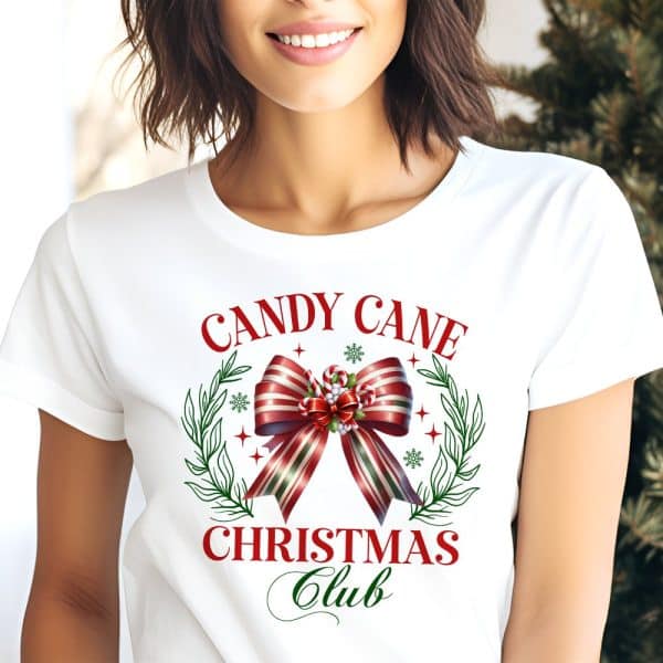 White T-Shirt With A Red And Green Candy Cane Bow Graphic And The Text Candy Cane Christmas Club.