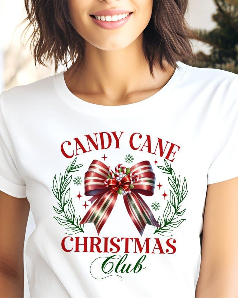 White t-shirt with a red and green candy cane bow graphic and the text Candy Cane Christmas Club.