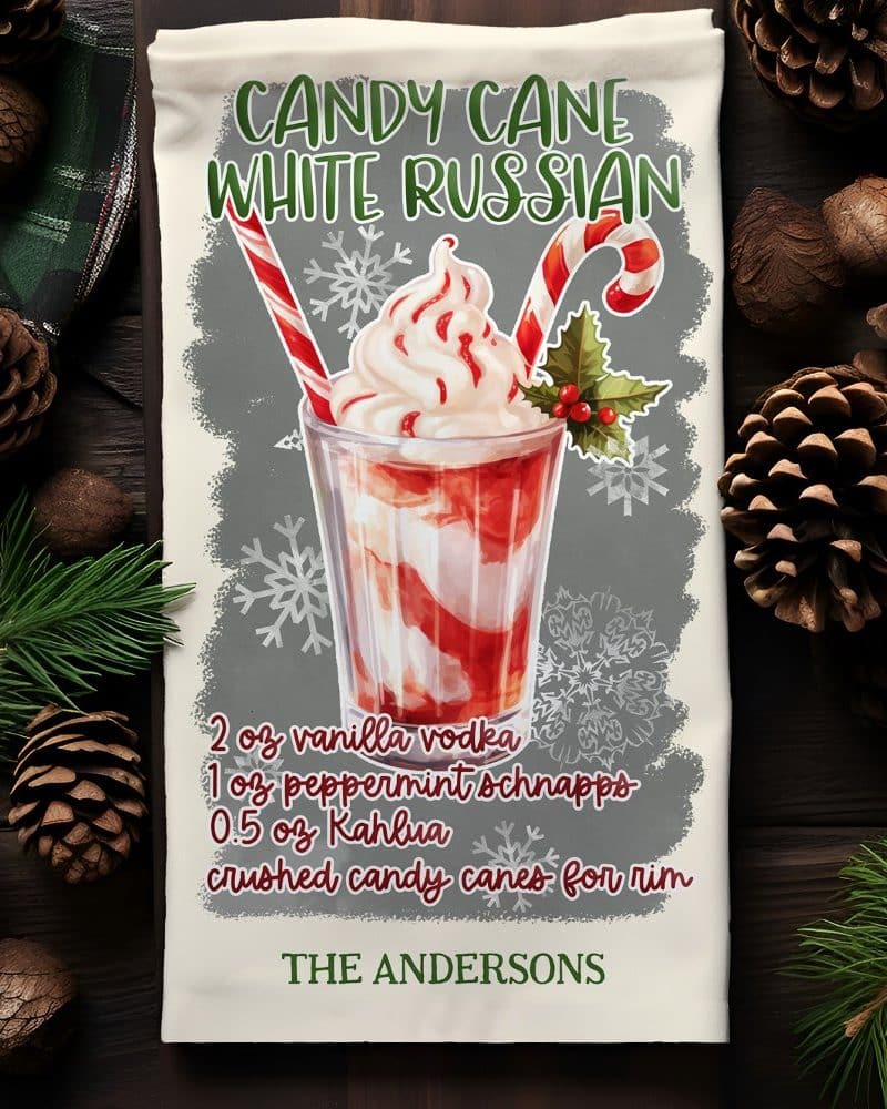 A kitchen towel featuring a watercolor illustration of a Candy Cane White Russian cocktail.