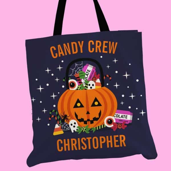 Dark Blue Halloween Candy Tote Bag With A Jack-O'-Lantern Design, Candy, And The Name Christopher.