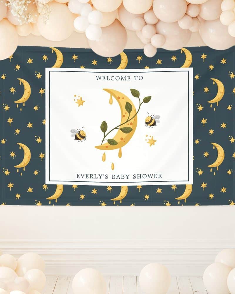 Baby shower banner featuring a crescent moon with dripping honey, leaves, and bees. The text reads, "Welcome to Everly's Baby Shower".