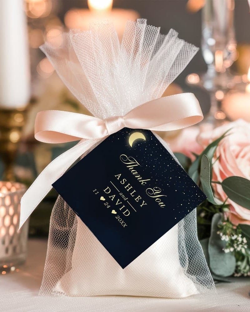 Wedding favor bag with a navy thank you tag featuring the names Ashley and David and wedding date.