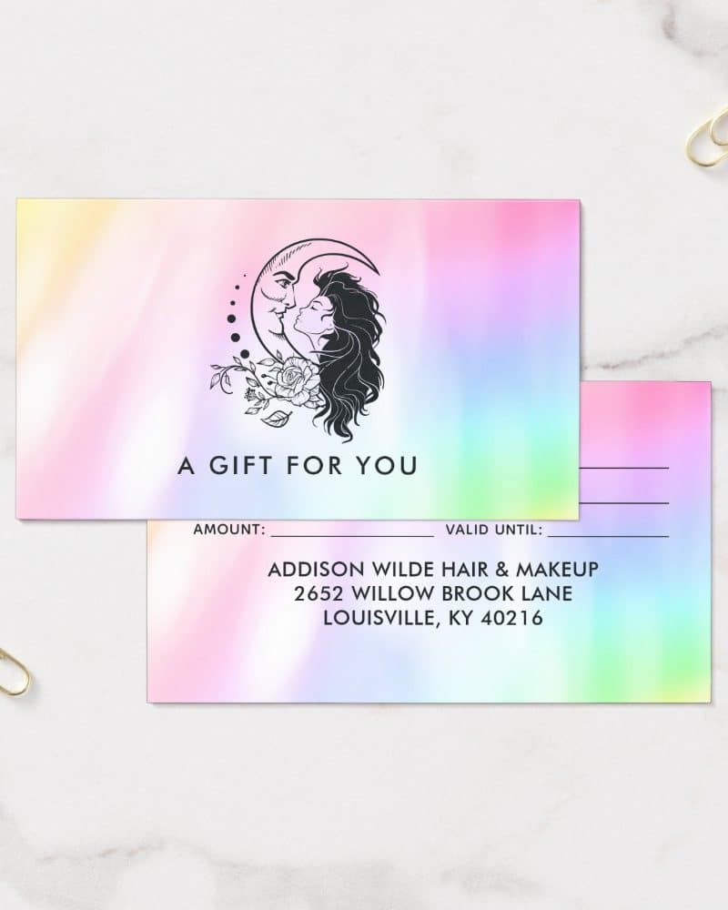 Pastel rainbow gift certificate featuring a woman's face and hair silhouetted against a crescent moon. Business information is included below.