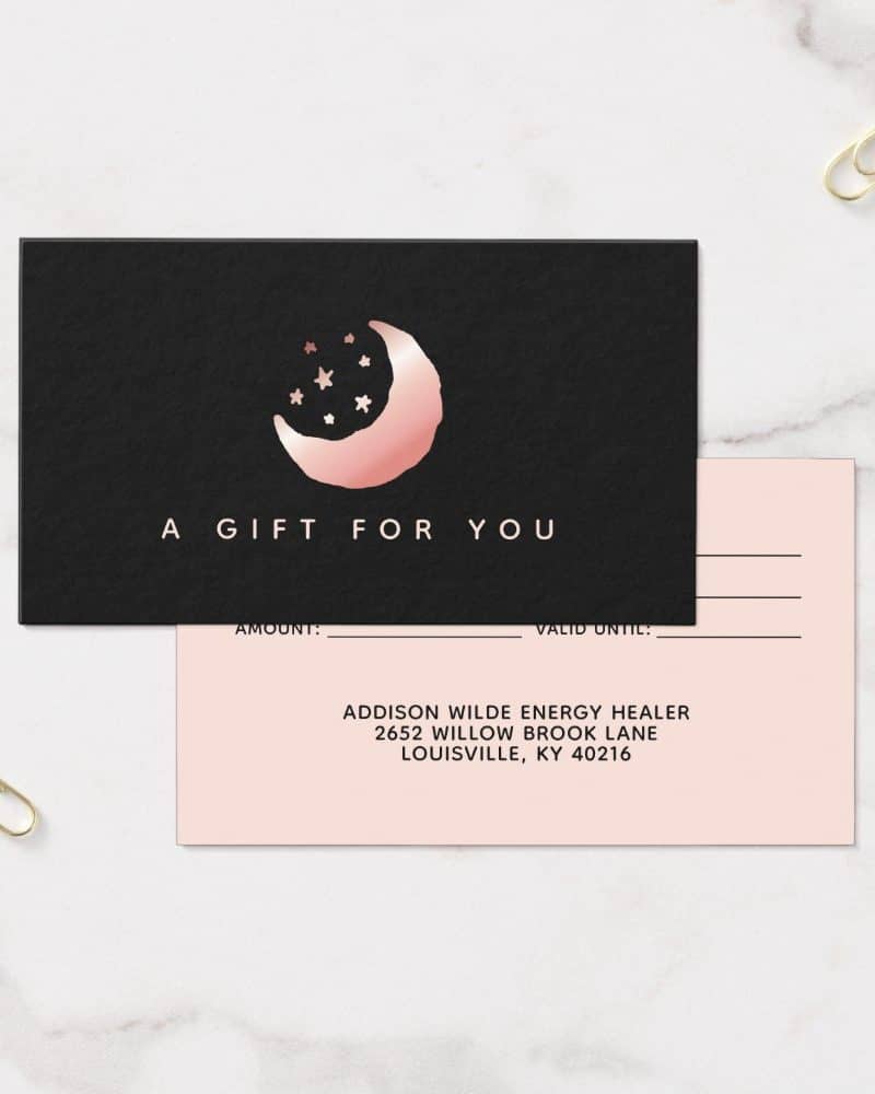 Rose gold crescent moon and stars on a black gift certificate.