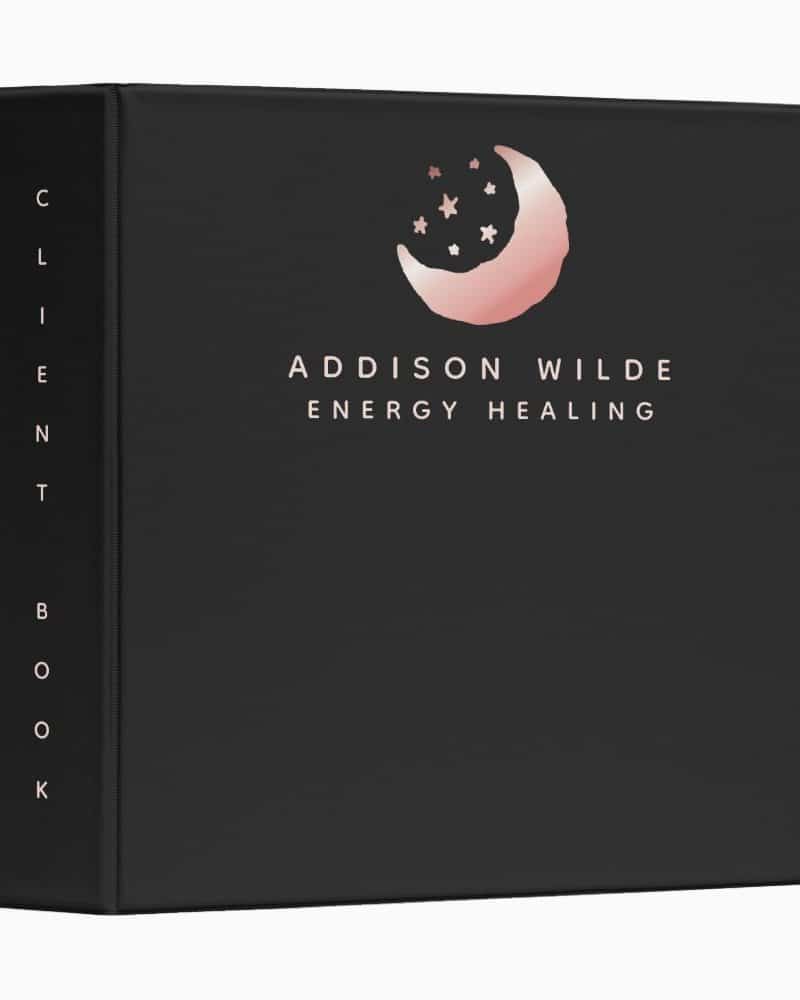 Black client book for Addison Wilde Energy Healing, featuring a rose gold crescent moon and stars logo.