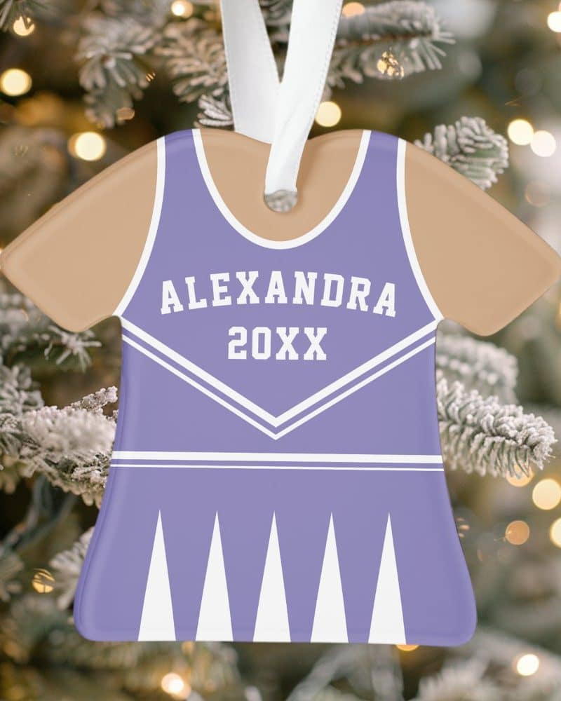 Purple and tan cheerleader uniform shaped Christmas ornament with a name and year.