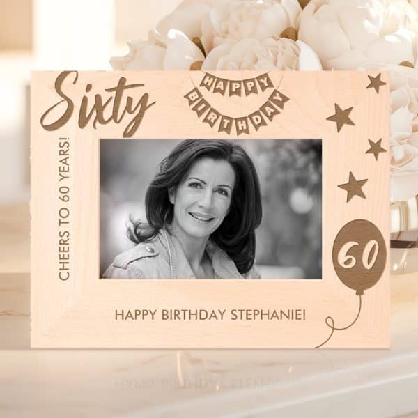 Light Wood 60Th Birthday Photo Frame With A Black And White Photo Of A Woman, The Number Sixty, And The Words Happy Birthday.