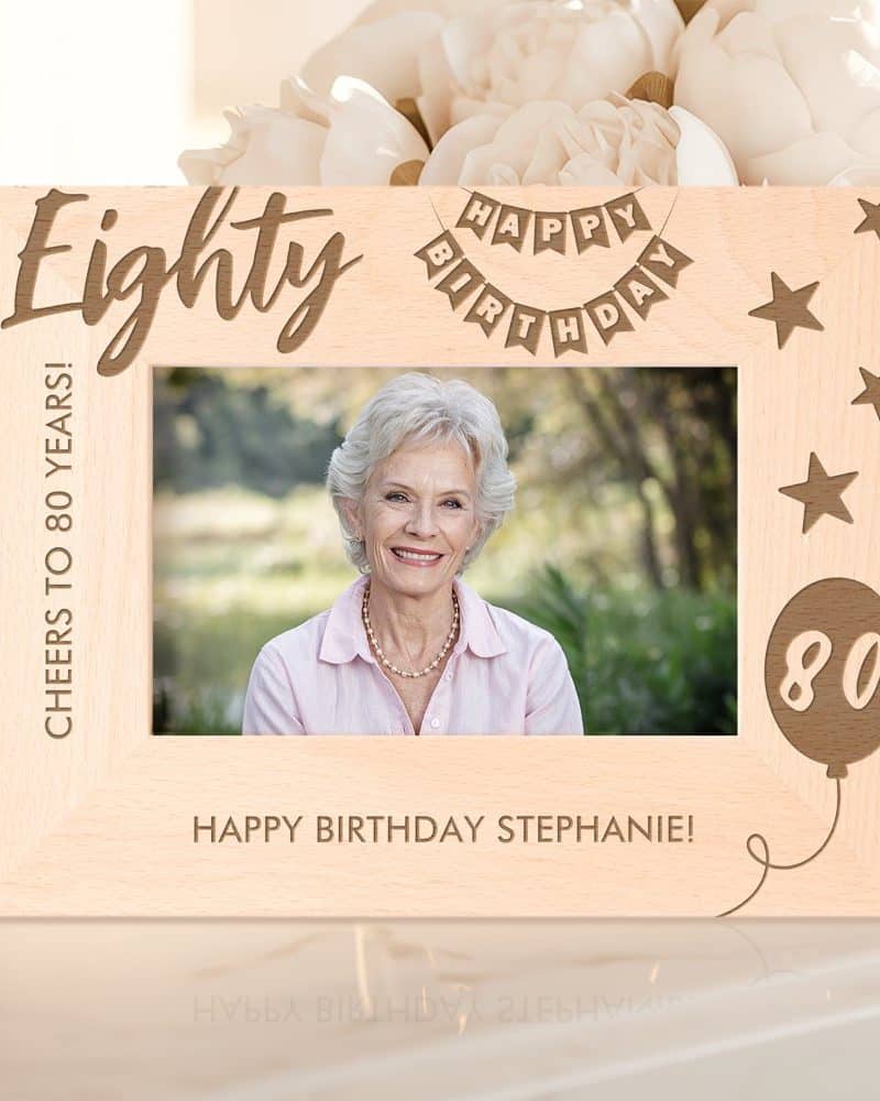 Wooden photo frame celebrating an 80th birthday. A photo of Stephanie is in the frame.