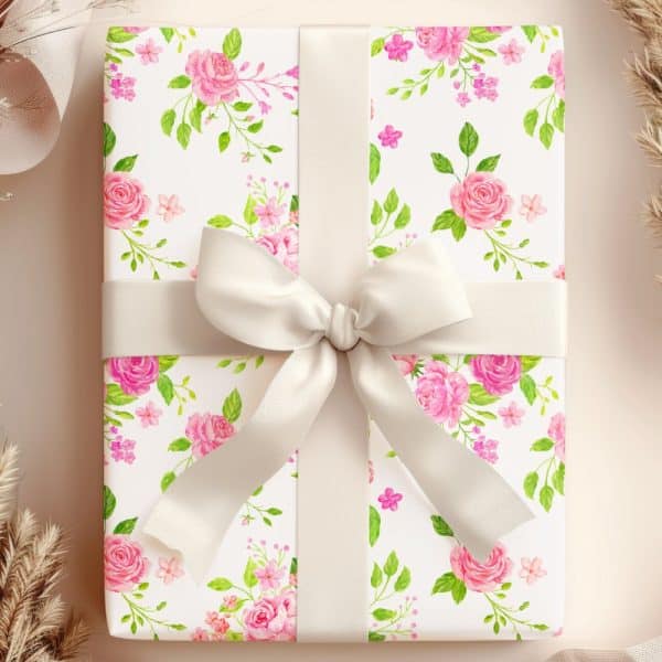 Gift Wrapped In Pink Rose Floral Paper With A Cream-Colored Ribbon.