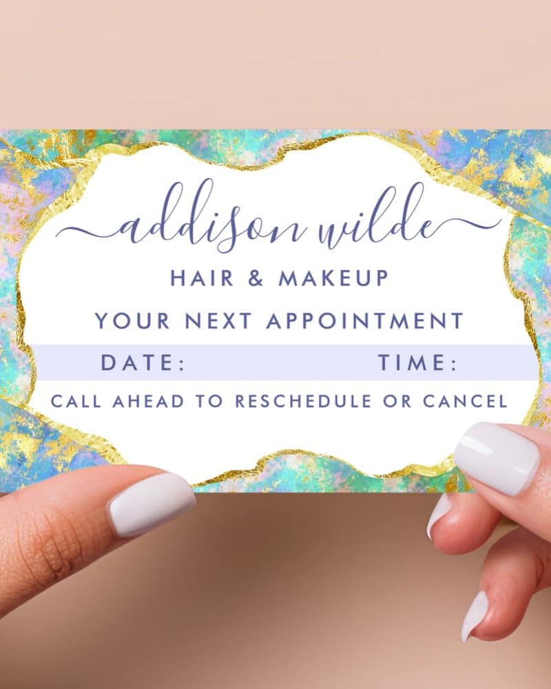 Appointment reminder card for Addison Wilde Hair & Makeup, featuring a pastel blue and gold design.