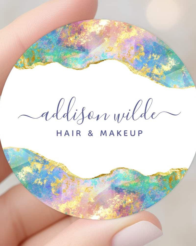Round sticker with pastel and gold abstract design; Addison Wilde Hair & Makeup.