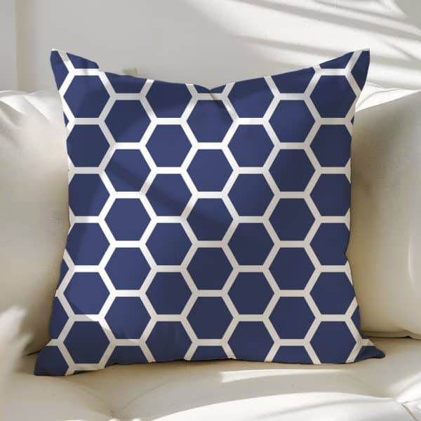 Navy Blue Throw Pillow With A White Honeycomb Pattern.