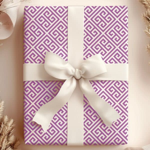 Gift Wrapped In Purple And Cream Greek Key Patterned Paper With A Large White Bow.