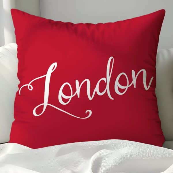 Red Pillow With The Word London In White Script.