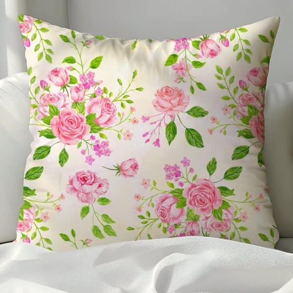 Cream Pillow With A Pink Rose Floral Pattern.