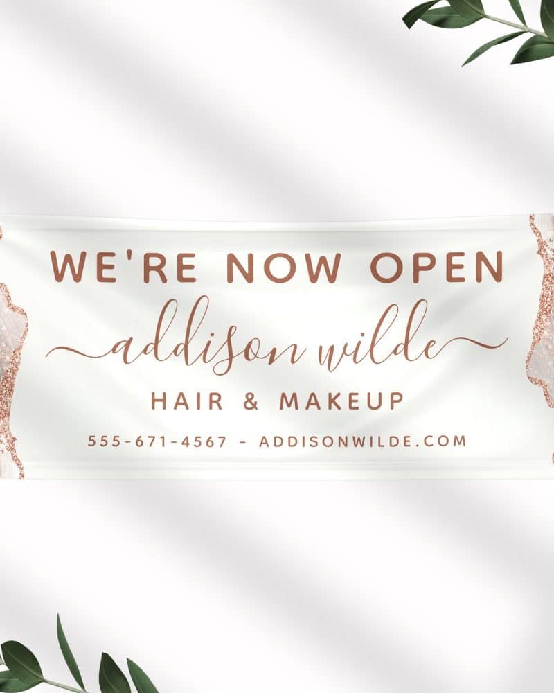Grand opening banner for Addison Wilde Hair & Makeup. Contact information is included.