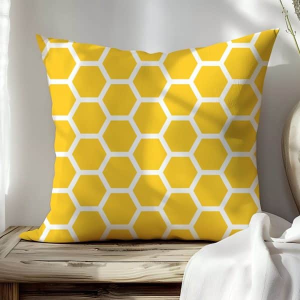 Yellow Square Pillow With A Honeycomb Pattern.