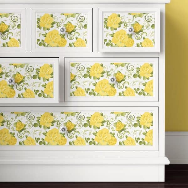 White Dresser With Yellow Rose And Green Leaf Patterned Drawer Fronts.