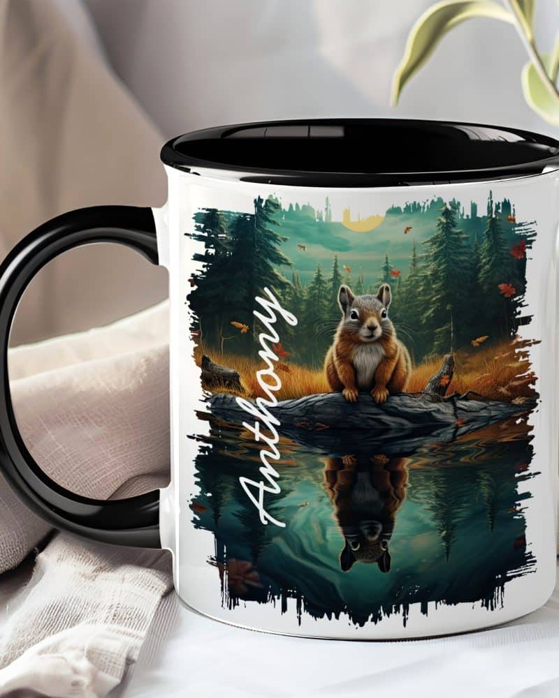 Black-handled mug with a personalized name, Anthony, and a squirrel sitting on a log reflected in water, set against a forest backdrop.