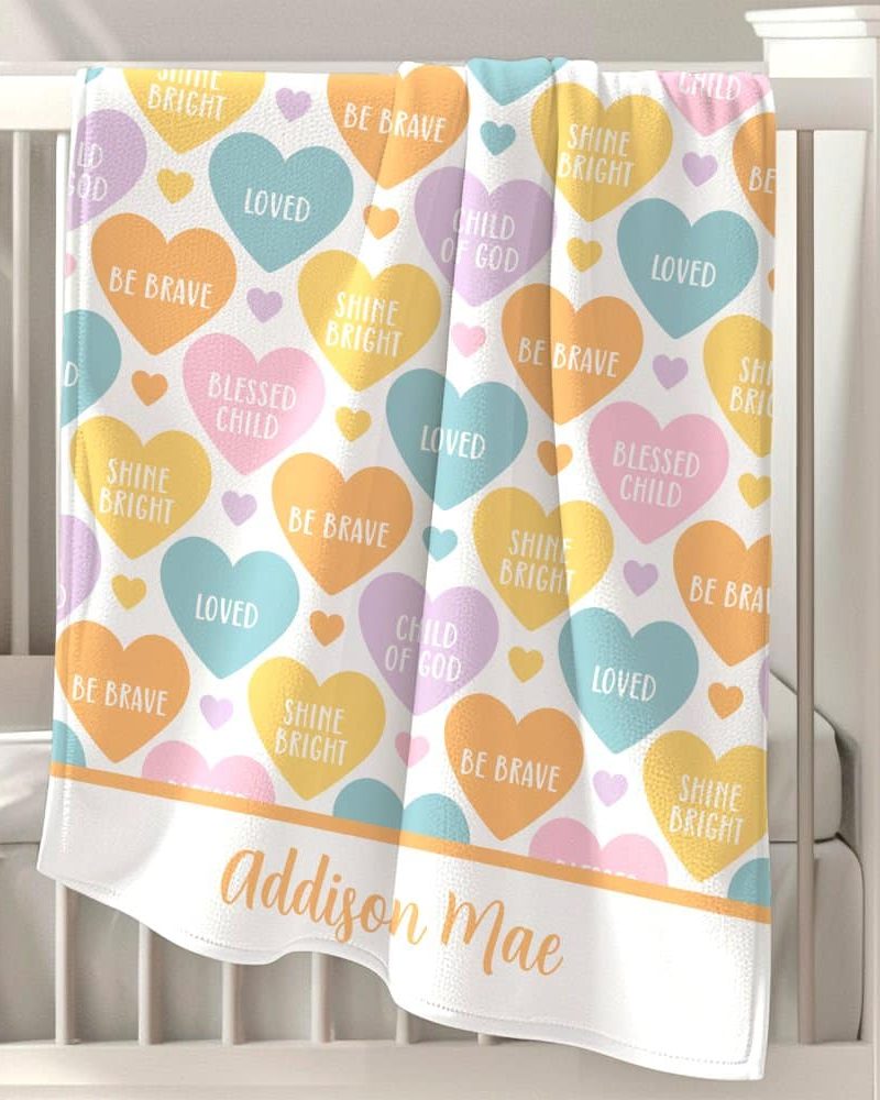 Personalized baby blanket with pastel hearts and encouraging words.