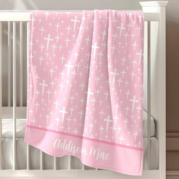 Pink Baby Blanket With White Cross Pattern And Personalized Name.
