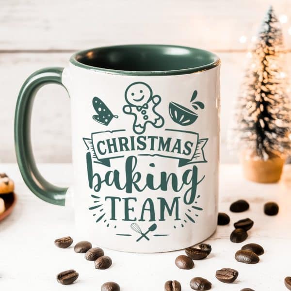 White Coffee Mug With Green Interior And Handle, Featuring A Christmas Baking Team Design.