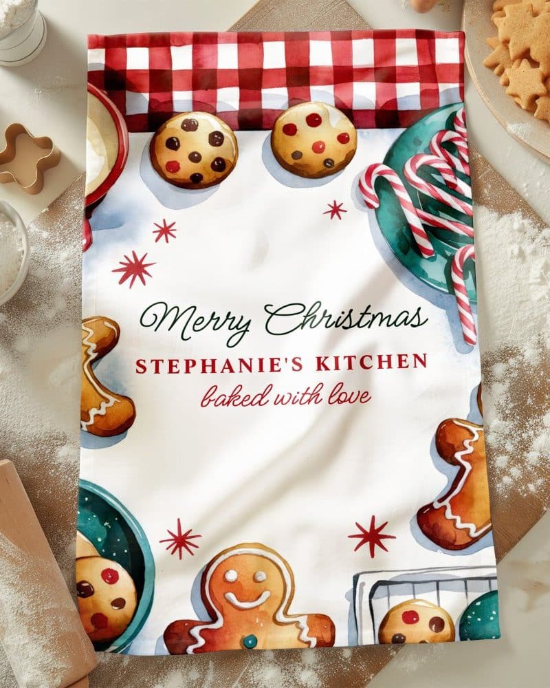 Christmas tea towel with watercolor gingerbread men, cookies, and candy canes; text reads Merry Christmas, Stephanie's Kitchen, baked with love.