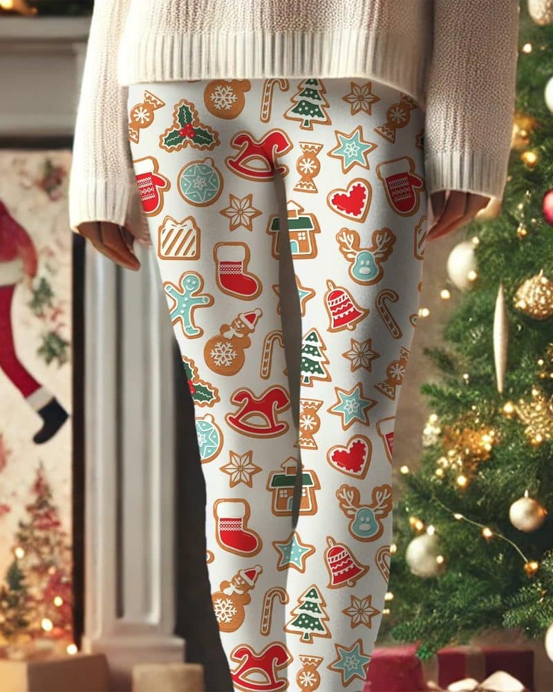 Person wearing cream-colored leggings with a festive Christmas gingerbread cookie pattern.