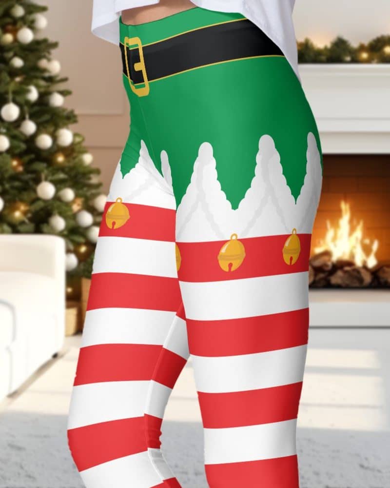 Elf-themed leggings with red and white stripes and a green elf costume waistband.