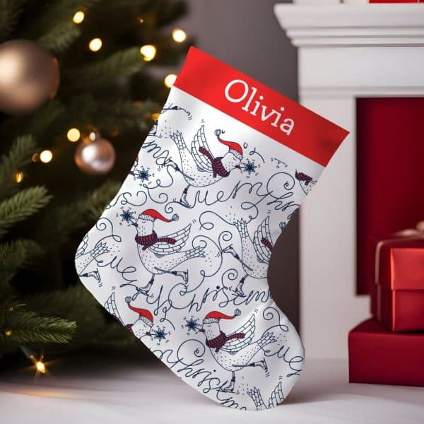 Personalized Christmas Stocking With A Pattern Of Birds Ice Skating And The Name Olivia.