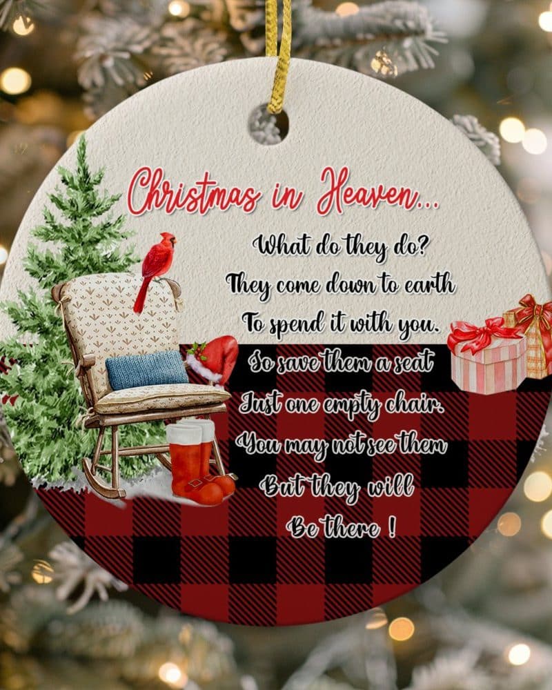 Round Christmas ornament with red and black buffalo plaid background, featuring a rocking chair, cardinal, and poem about loved ones in Heaven.